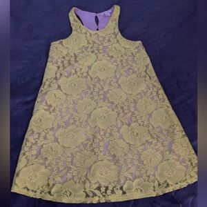 A yellow dress. XS. Has a cream color underneath dress.